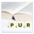 Perfekt planliegendes Buch mit Scrabble-Buchstaben "P", "U" und "R" im Vordergrund